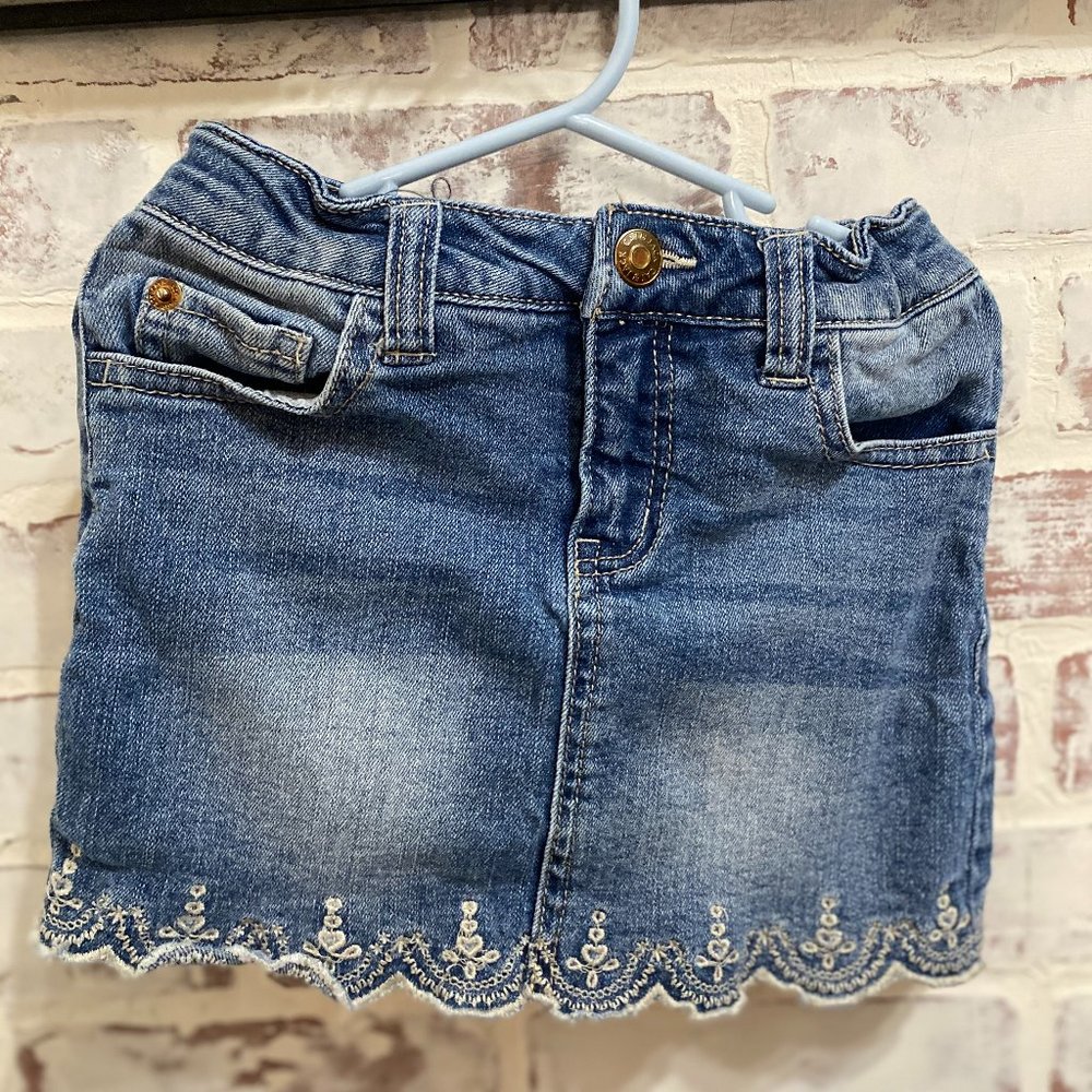 Denim skirt with embroidered hem